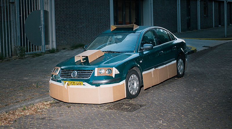 Illustration for article titled This Artist Turns Boring Rides Into Supercars At Night Using Cardboard